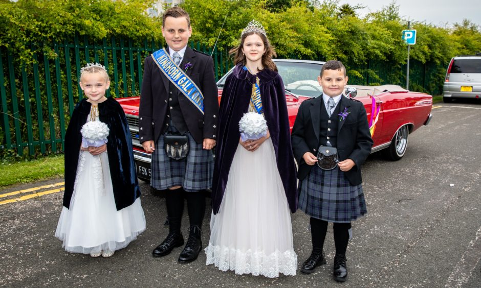 Attendant Isla McGovern (7), Gala King Liam Nikiperowicz (11), Gala Queen Erin McIlravie (12) and Attendant Aiden Cunningham (8) before the parade begins. Steve Brown / DCT Media