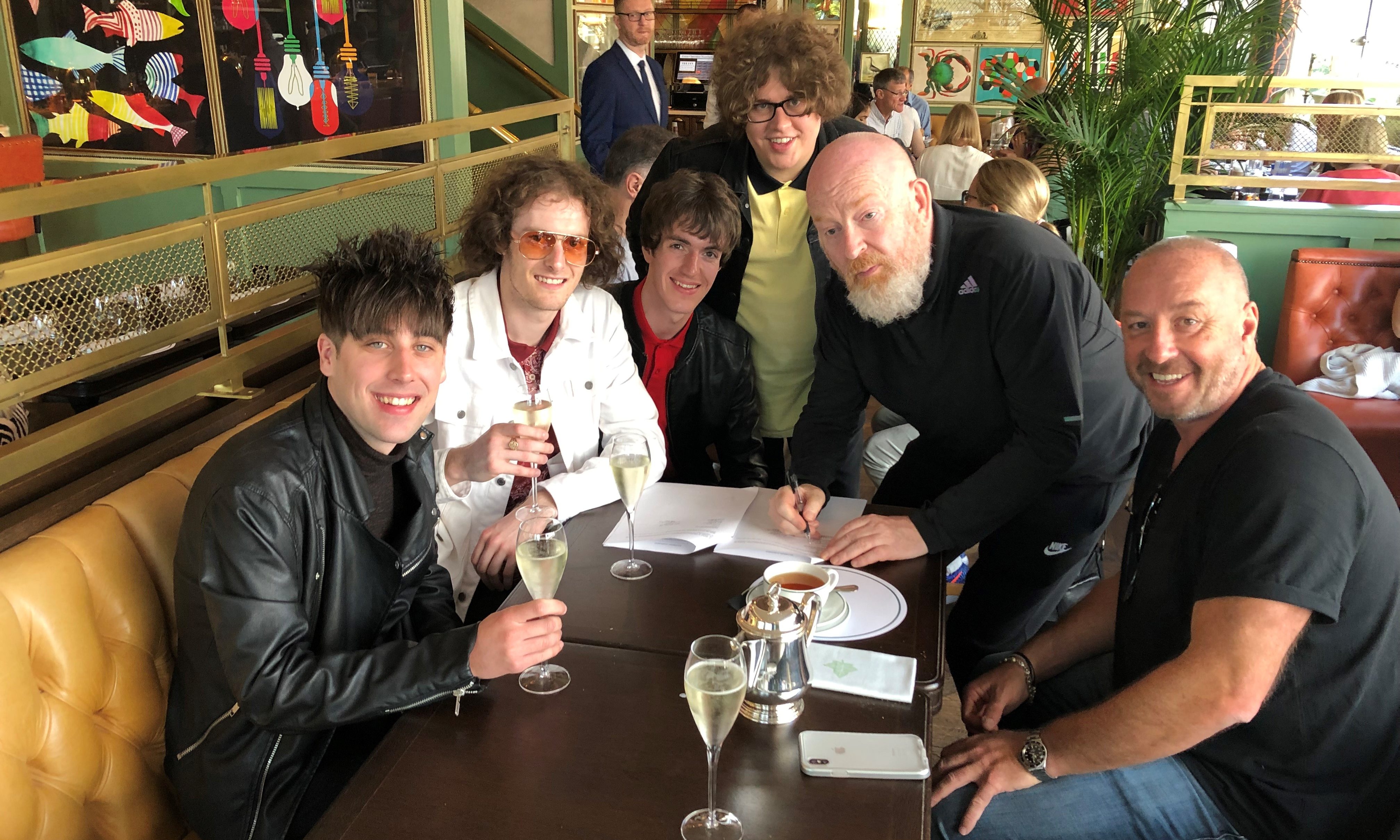 Fife band Shambolics have signed to Creation 23 - the new record label set up by music mogul Alan McGee.
(from left) Jordan McHatton,  Darren Forbes, Lewis McDonald, Alan McGee, Jake Bain and Simon Fletcher