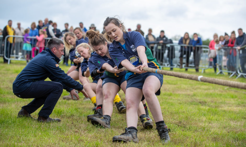 The young farmers put in the effort at the Tug-O-War.