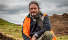 Dr Oliver O'Grady  helping to resolve a dig site at East Lomond in 2019