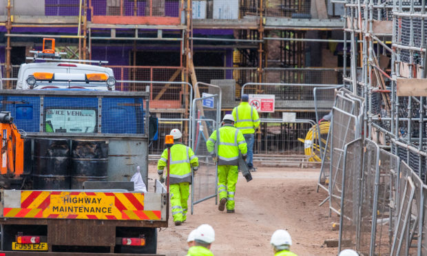 Workers install fencing at Lathro Farm site