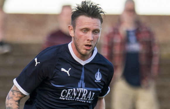 Jordan McGhee in action for Falkirk.