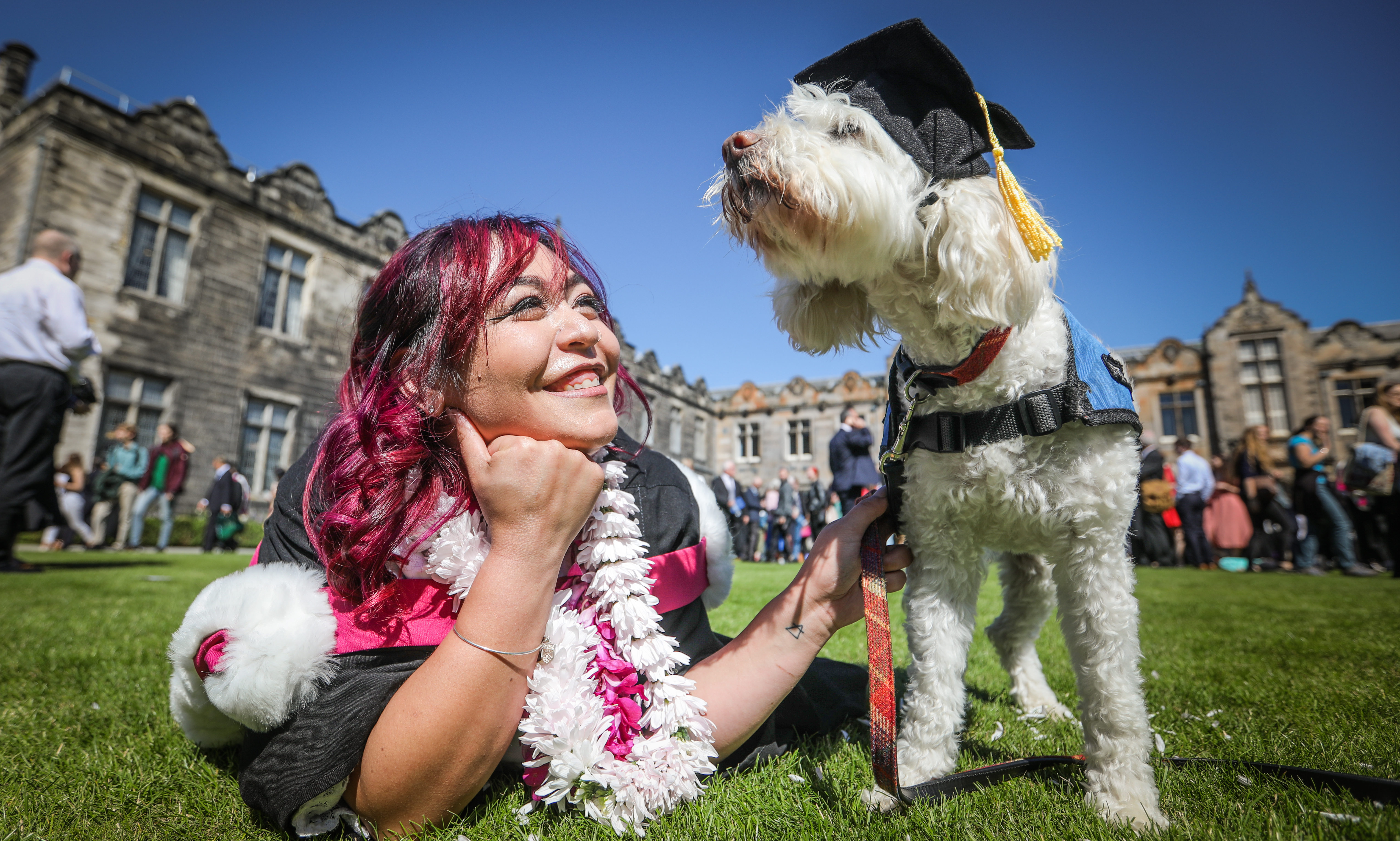 St Andrew's student Mika Schmeling, 22, graduated with her Emotional Support Dog Lulu, who has helped her complete her studies.. Picture by Mhairi Edwards/DCT Media