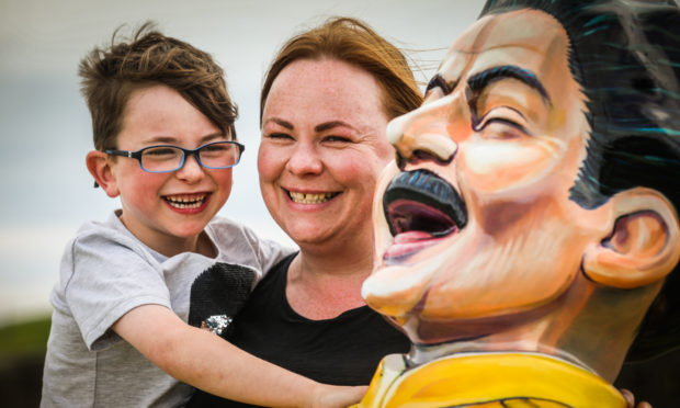 Winner Paula Malham and son Luca, 6, with the Freddy Mercury Oor Wullie.