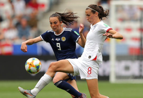 Caroline Weir battles for possession with Jill Scott.