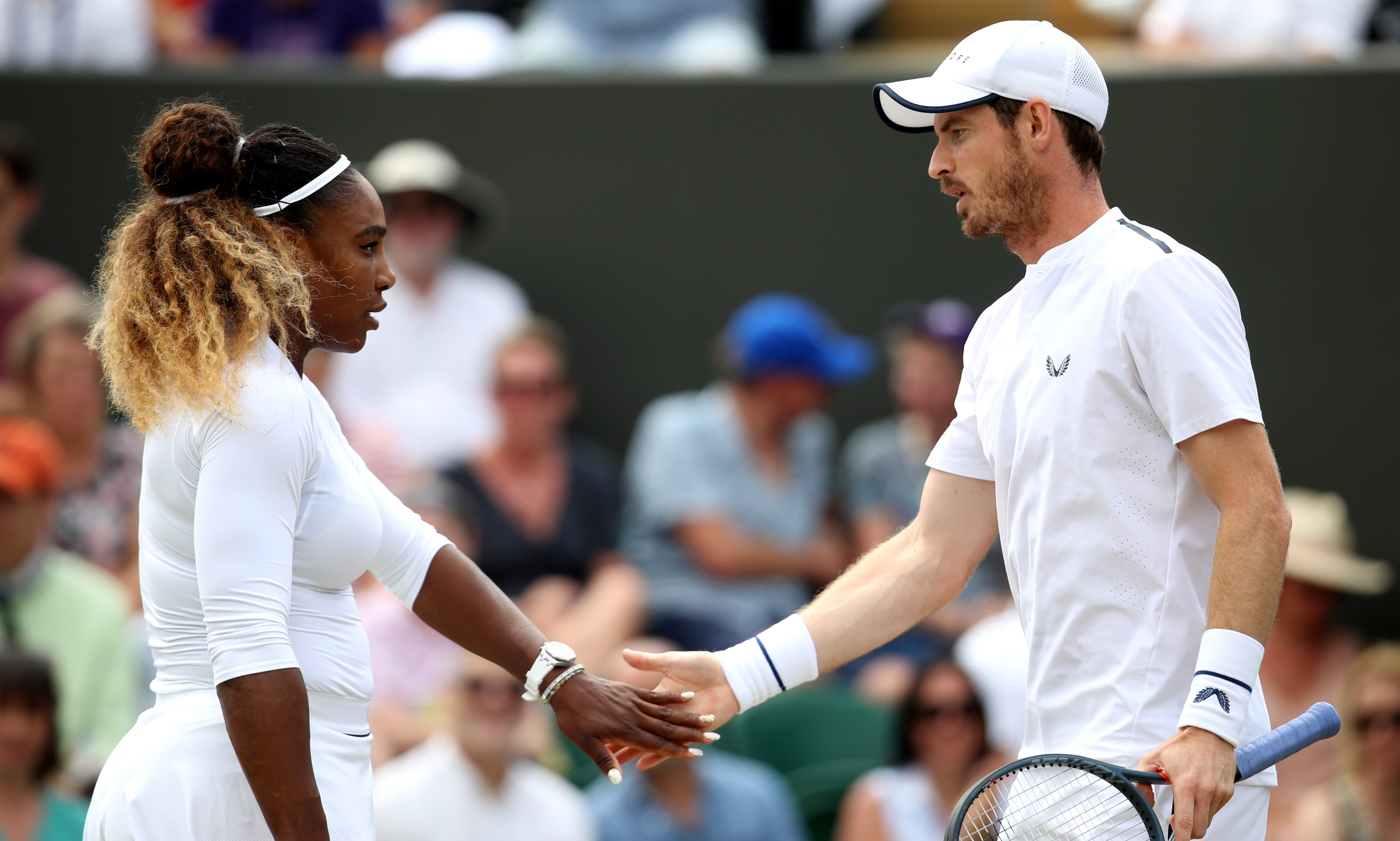 Andy Murray of Great Britain (R) and Serena Williams of the United States in their Mixed Doubles third round match against Bruno Soares of Brazil and Nicole Melichar of the United States.