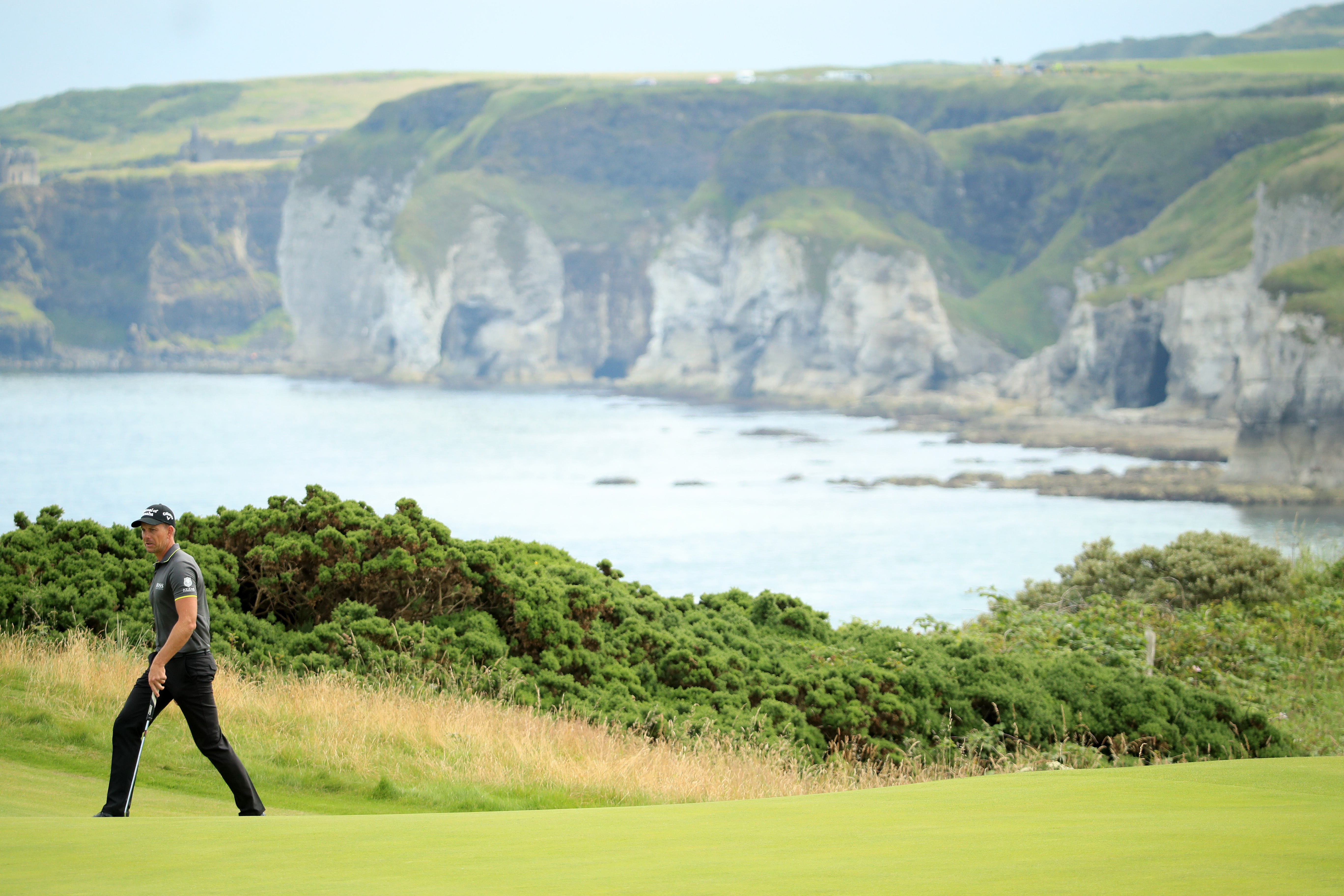 2016 champion Henrik Stenson on the march at the fifth at Royal Portrush, overlooking the Causeway cliffs.