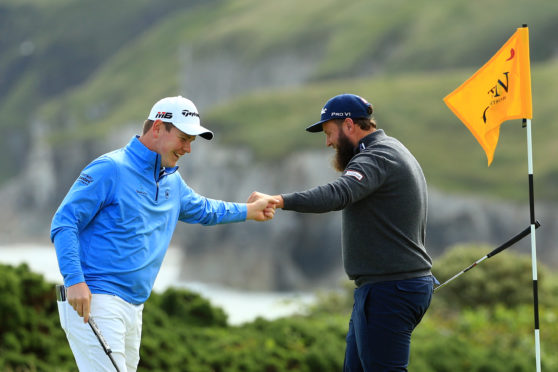 Robert MacIntyre and Andrew "Beef" Johnson congratulate each other at Royal Portrush,