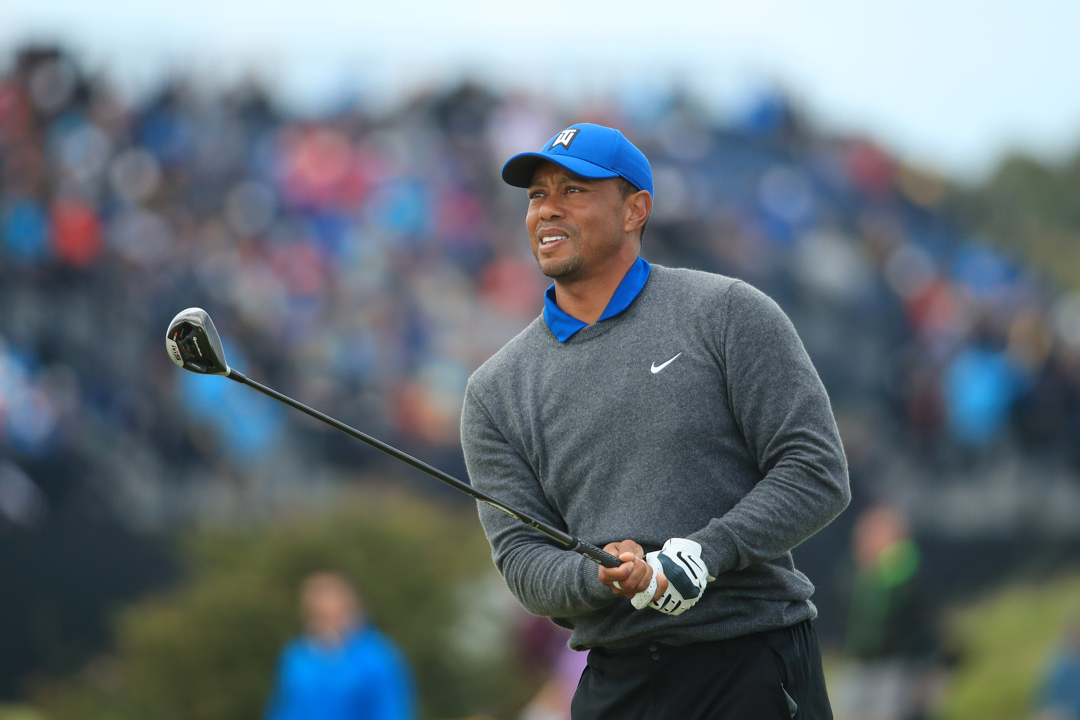 Tiger Woods struggled through a bad back and the cool, wet conditions at Royal Portrush.