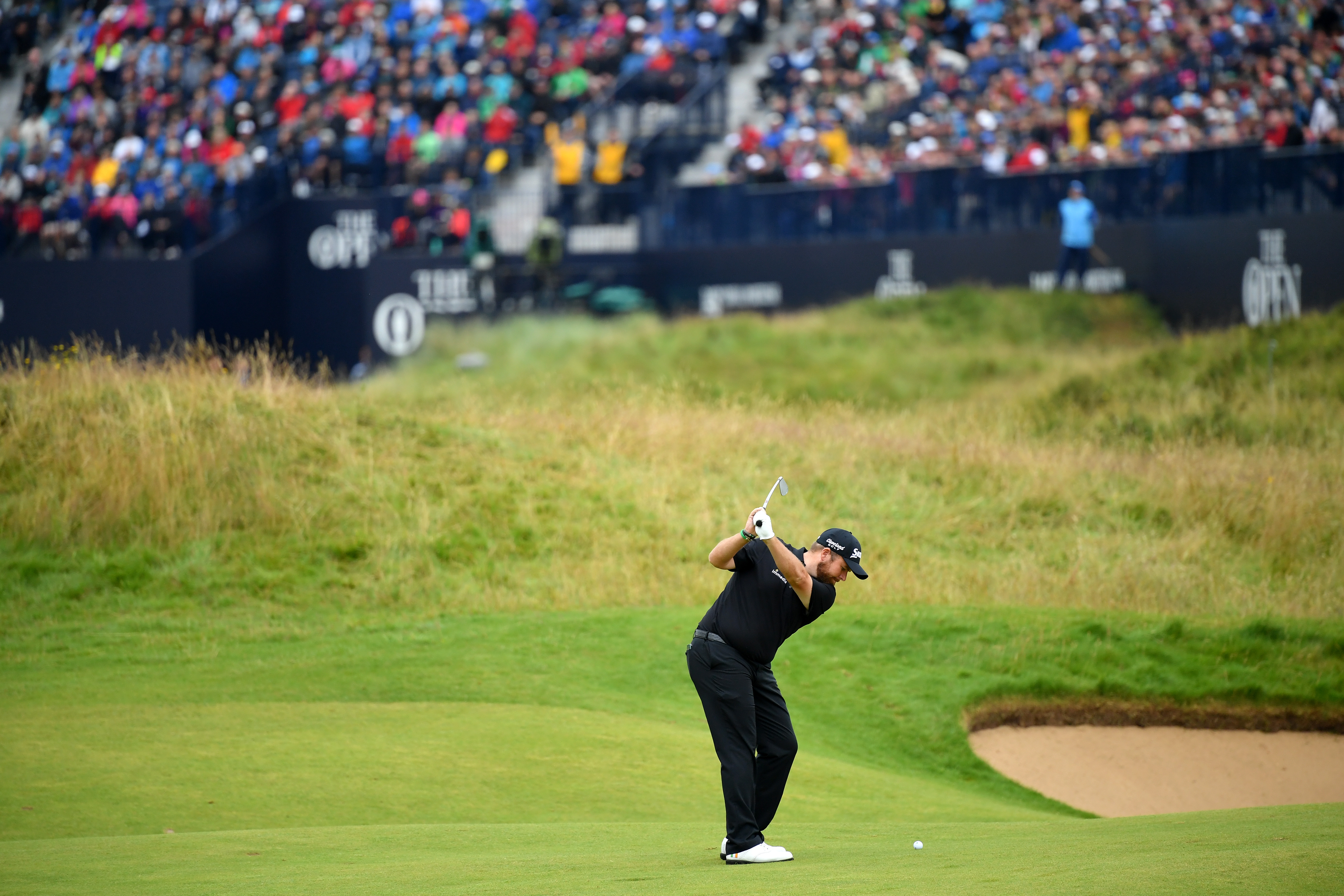 Shane Lowry of Ireland plays his second shot on the 18th hole.