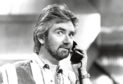 Presenter Noel Edmonds using a telephone on the set of a television show, October 24th 1989. (Photo by Don Smith/Radio Times/Getty Images)