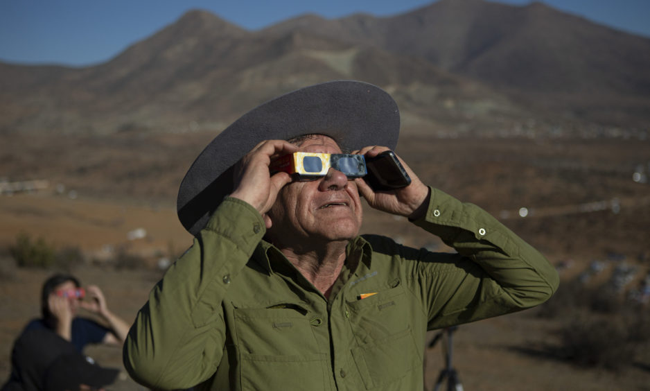 A man looks towards the eclipse.