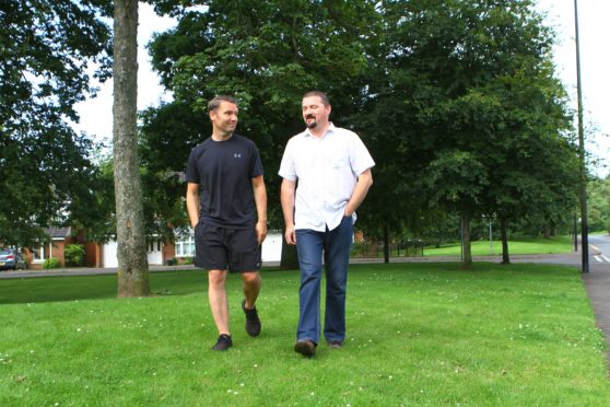 John Walsh, left, and his neighbour Philip Harrison claimed they didn't know about annual grass cutting fees