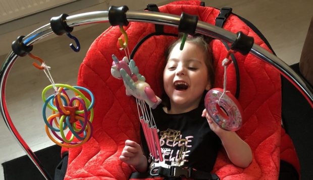 Emelia in her new chair.