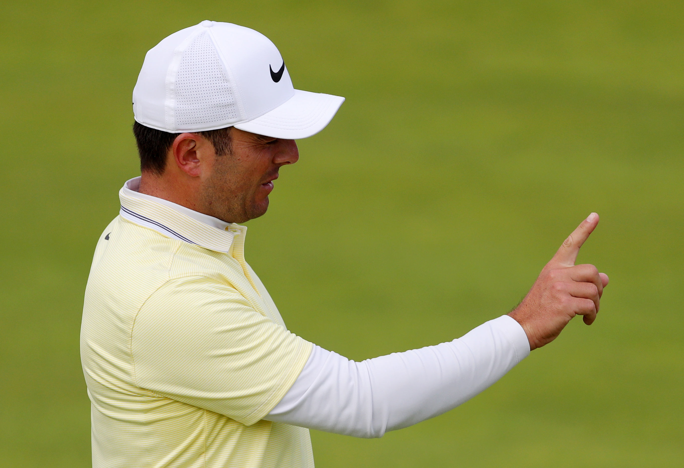 Italy's Francesco Molinari passe on the Open title to Shane Lowry.