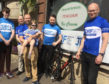 Getting on their bikes for a good cause are, from left, Morgan Traynor, Sean Colebourn, Franck (pictured with Anita); Nathan Owen and Milnathort shop manager Gregor Mcclung.