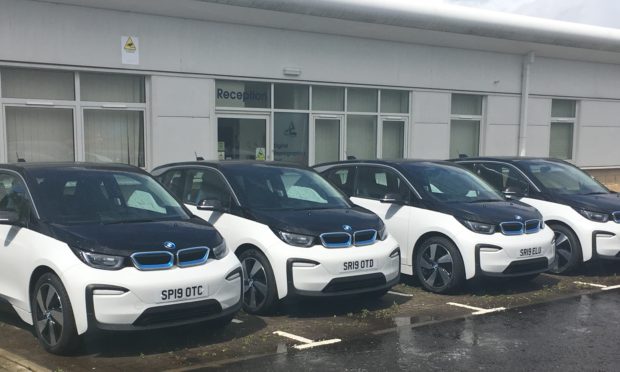 Weeds are growing around the little-used fleet of council BMW EVs.