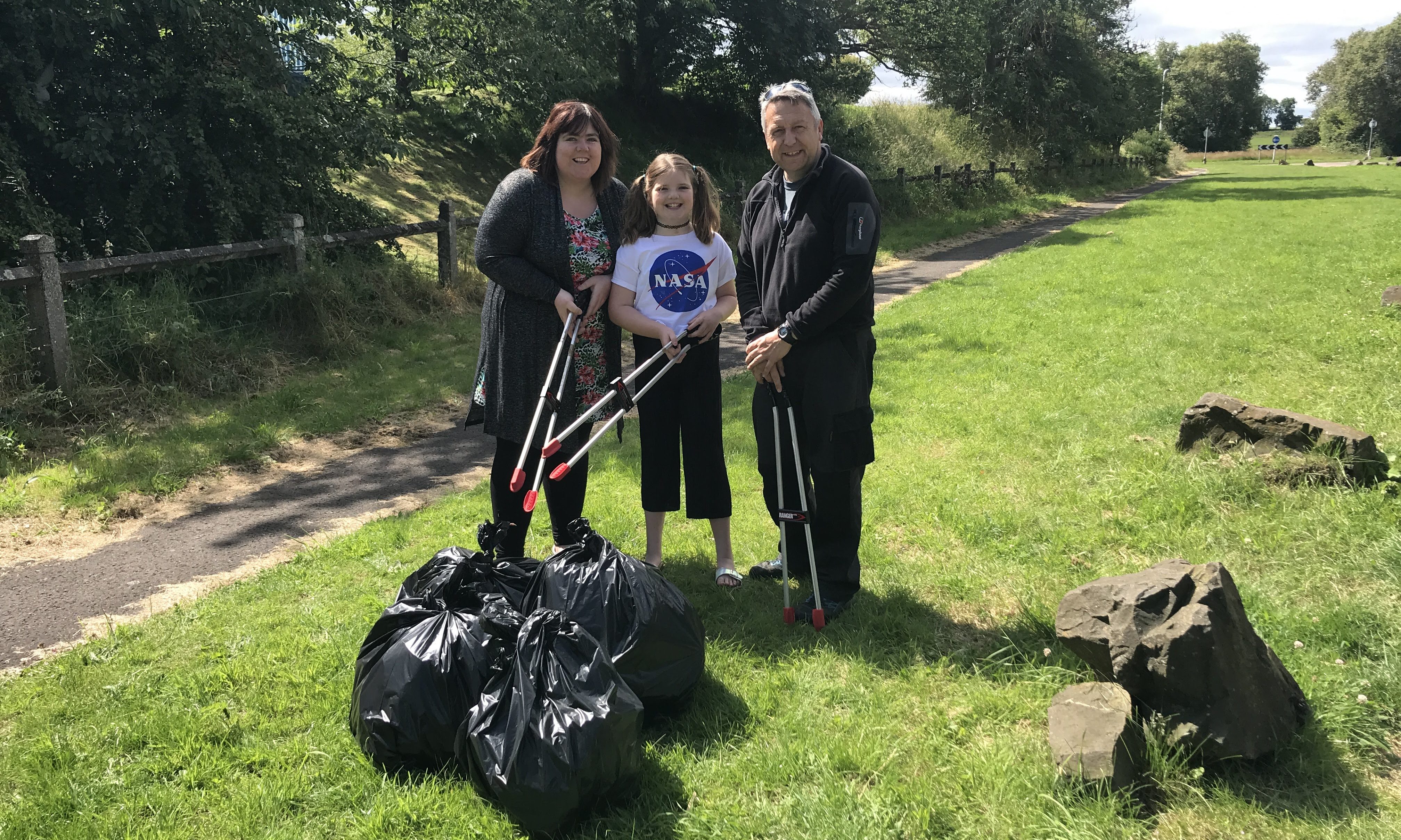 Angus Forbes, Gillian Docherty and her daughter, Hannah, 10, are fed up of seeing drivers leave a mess at Invergowrie.