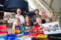 Ged Young and Aidan Williams from Aim Design with Anna Gilruth,6, head of development Rebecca Duncan and Luke Judson, 6.