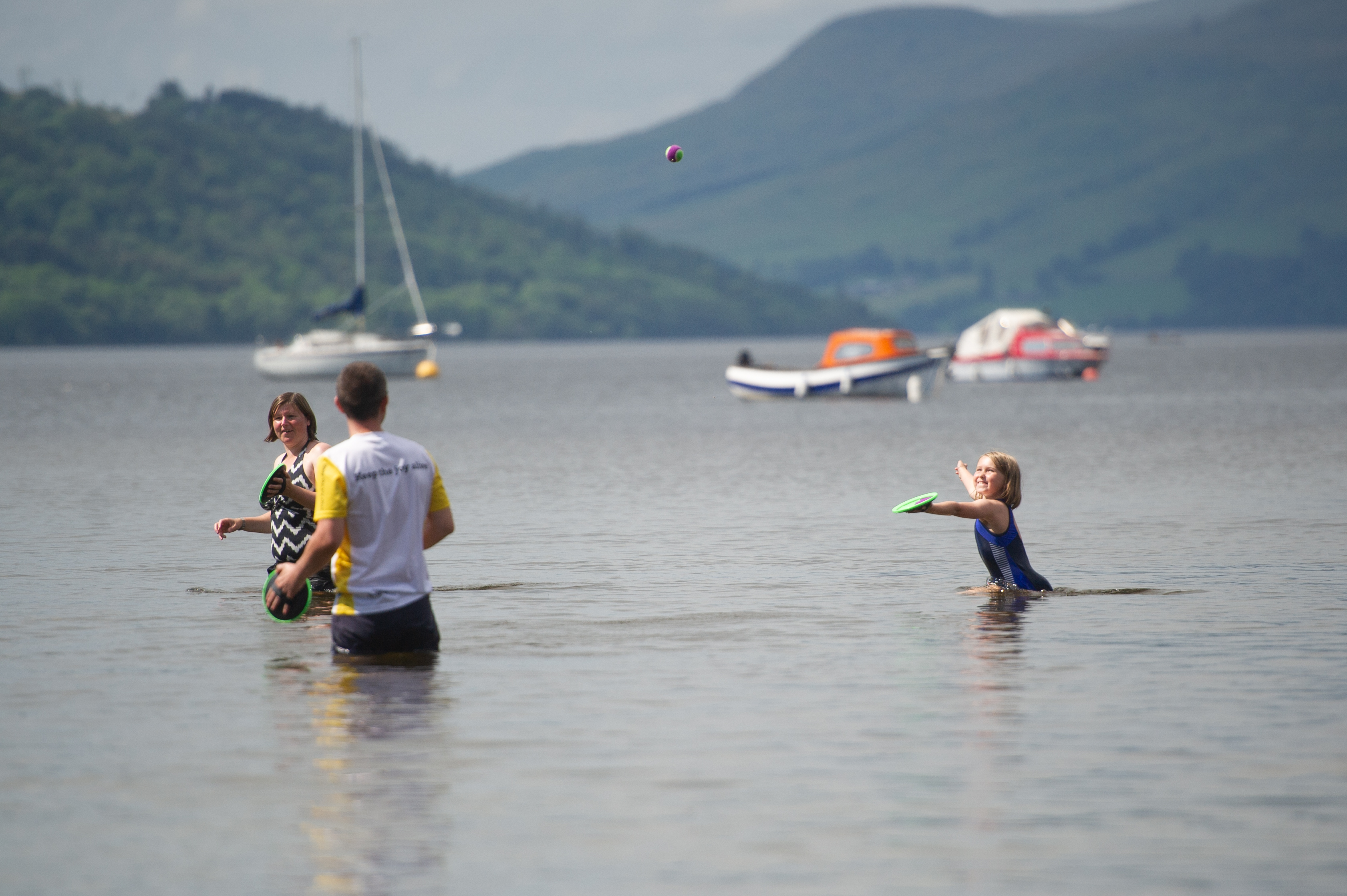 A family enjoys the July 2019 heat at Killin, Loch Tay.
