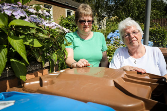 Denise and Mary Wallace beside bins in Rona Place, Glenrothes.