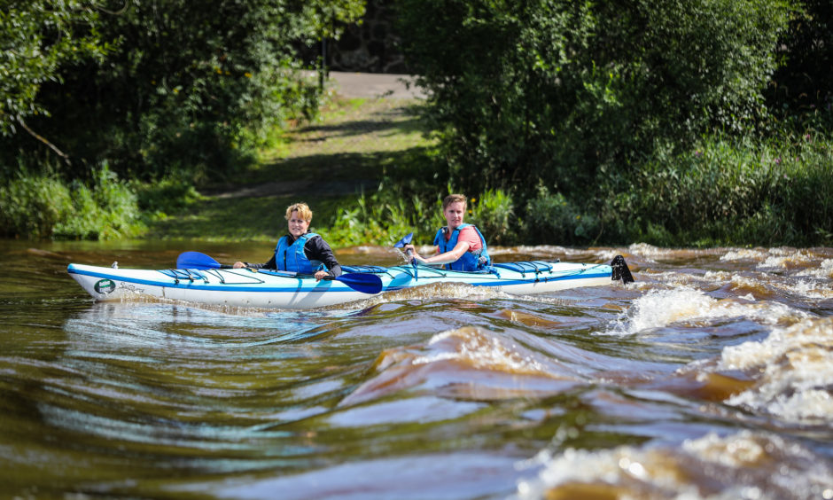 Kayakers take to the River Tay at Perth's Moncrieffe Island to try and cool down on the hottest day of the year.
Picture by Kris Miller / DCT Media.