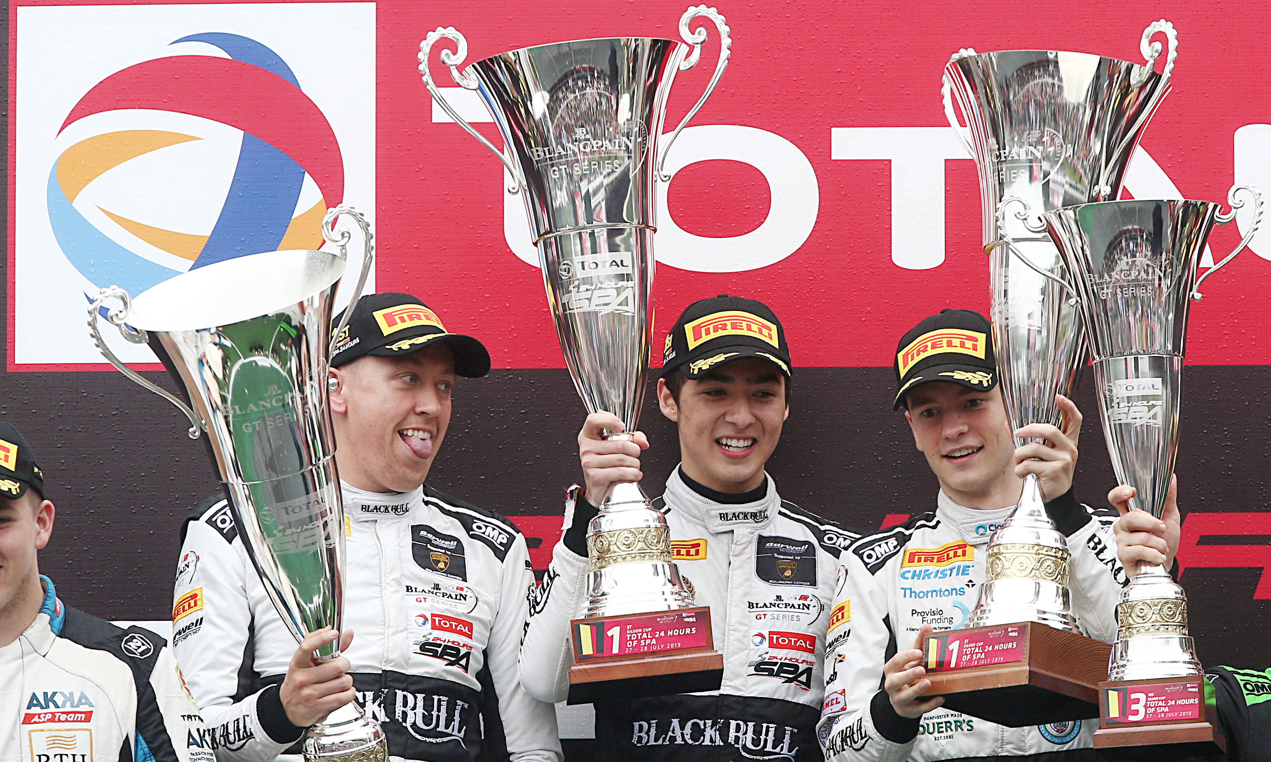 Sandy Mitchell (right) celebrates victory on the Spa podium in 2019.