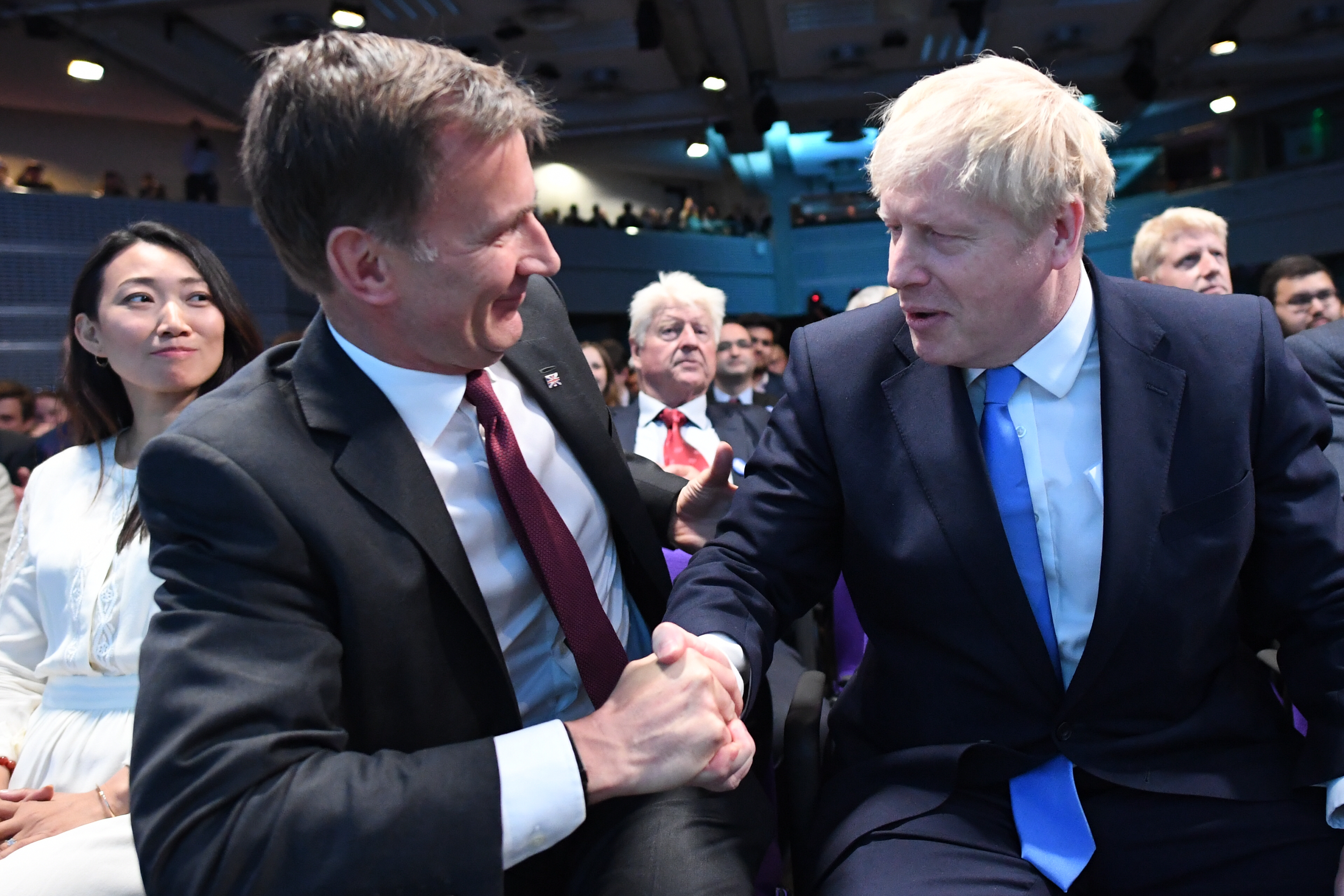 Jeremy Hunt (left) congratulates Boris Johnson at the Queen Elizabeth II Centre in London where he was announced as the new Conservative party leader.