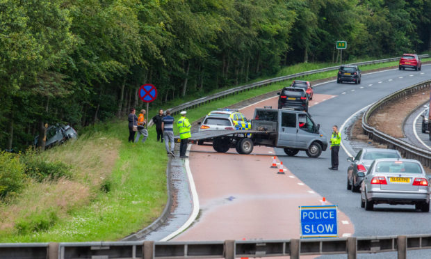 The car ended in a ditch overturned.