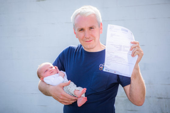 Kevin Coull and his daughter Isla who is angry at a parking ticket given at Ninewells Hospital