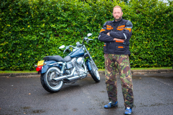 ames Begg and his motorcycle.