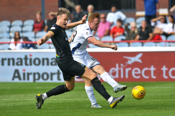 Danny Johnson fires Dundee into last 16.