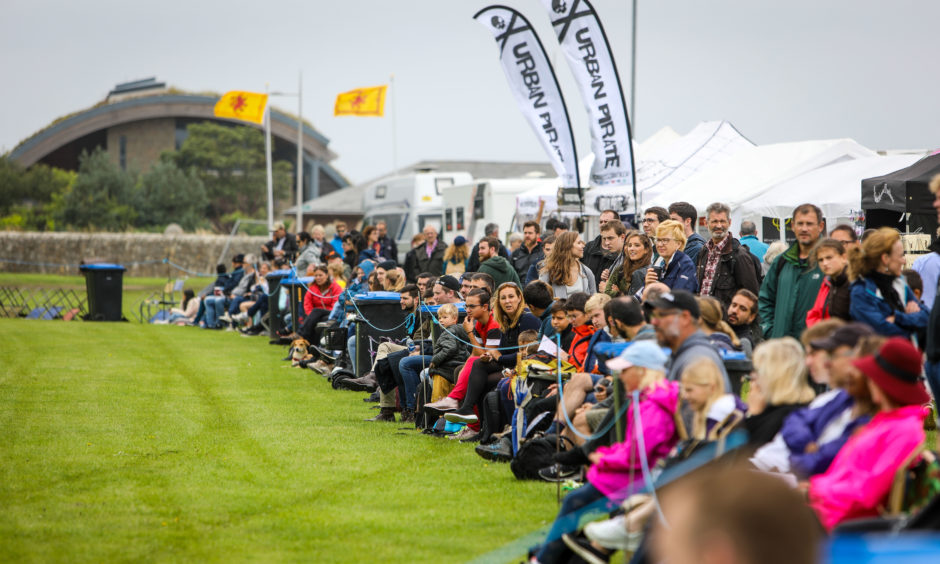 Crowds line the track waiting on the official opening of The St Andrews Highland Games.
All pictures by Steve Brown / DCT Media