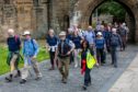 Walkers make their way on a special 8.5-mile section of the Pilgrim Way as part of the official opening day. Some donned costumes to mark to occasion.