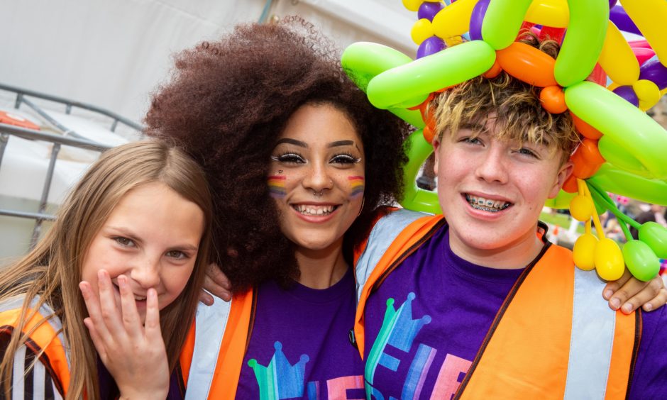 Volunteers Nicole Allan (13), Megan Hall (16) and Arron Kennedy (13) all colourful at Pride Kirkcaldy.