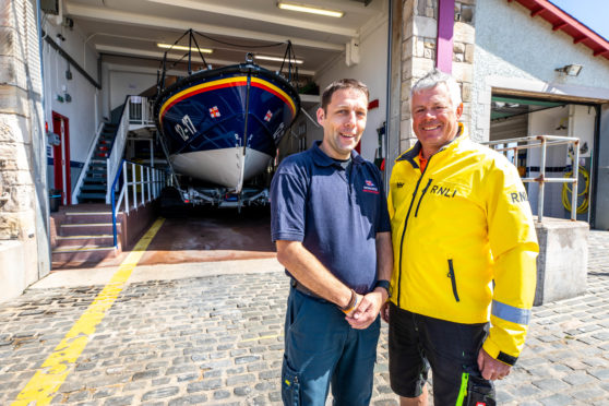Michael Bruce, coxswain and mechanic, with lifeboat operations manager Roy Giles outside the current Anstruther RNLI station.