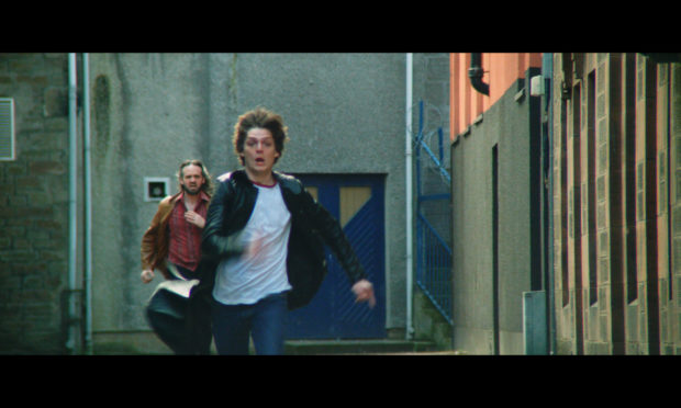 Connor Berry, who plays Dave McLean in Schemers, during a chase scene