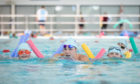 Scottish Swimming Learn to Swim ambassador Duncan Scott takes to the water with local children