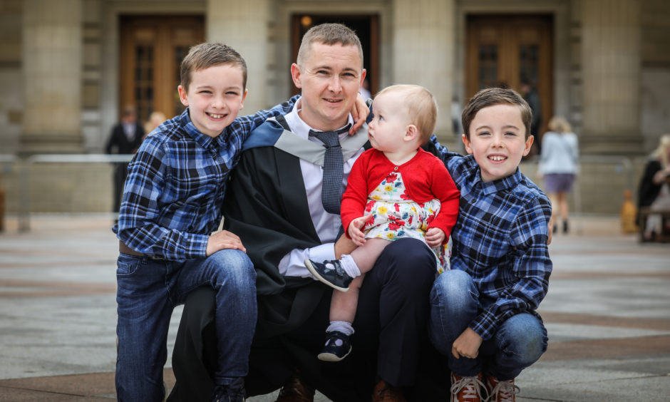 Stephen Blacklaw, 38, from Birkhill,  graduates in Civil Engineering with his children l to r, Reece, 9, Aurora, 1, and Oliver, 9.