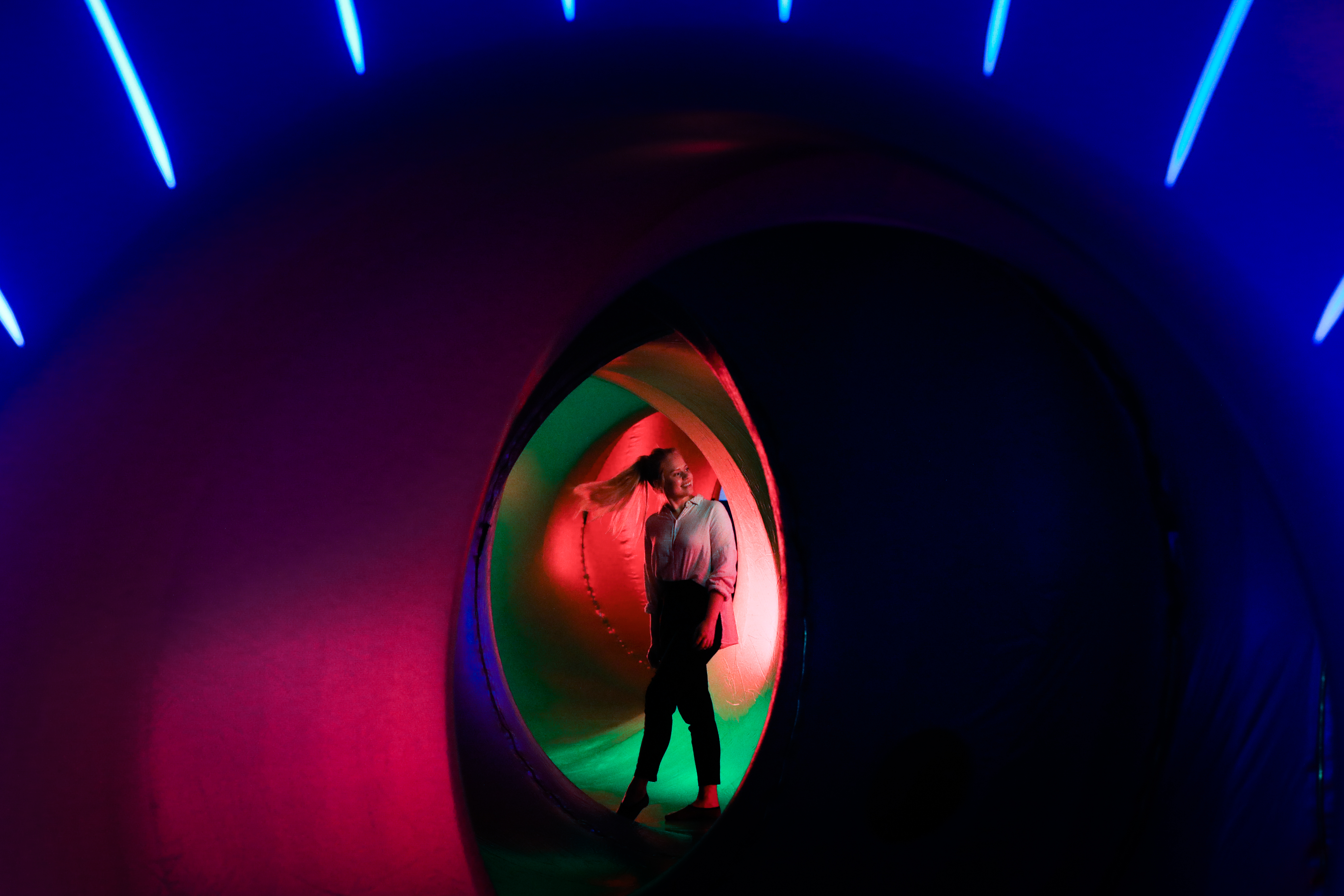 People wander through the domes of the luminarium.