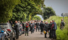 Motorcyclists from the convoy pay their respects at Kinnordy Loch.