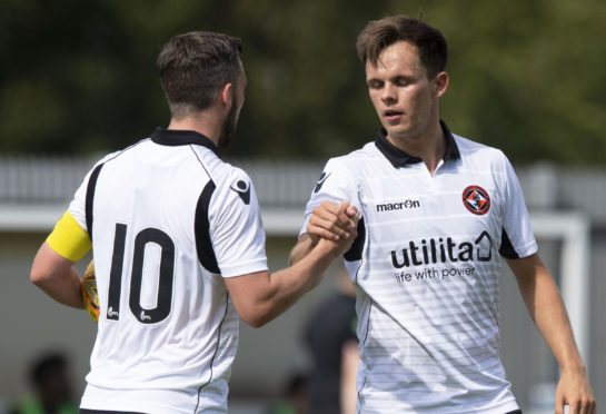 Nicky Clark and Lawrence Shankland celebrate a goal at Dumbarton.
