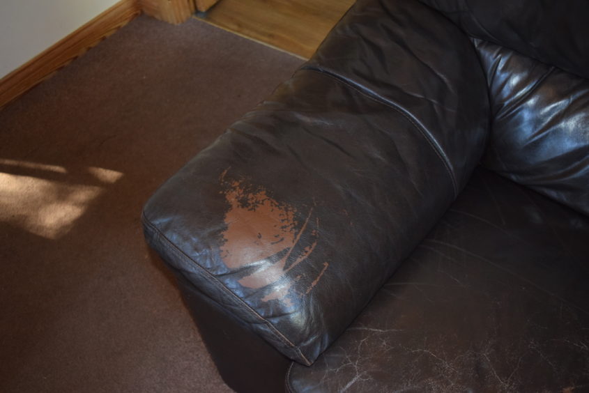 The sofa was badly marked and damaged