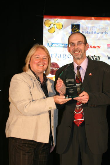 Alastair Brodie of Groucho's is presented with the Independent Trader of the Year awardat the 2008 Retail Awards 2008.