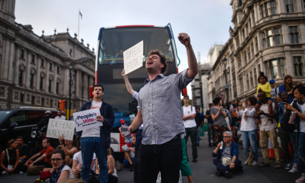 Pro-EU supporters protest outside the Houses of Parliament on August 28, 2019 in London.