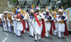 The Sikh Pipe Band march through Kenmore
