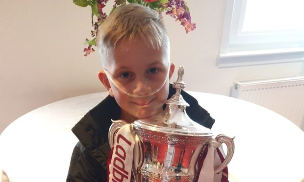 Harri with the League One title won by Arbroath last season.