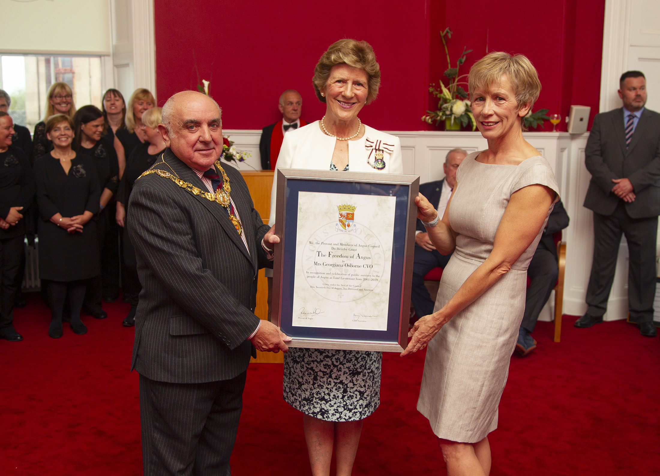 Mrs Osborne (centre) with Angus Provost Ronnie Proctor and Angus Council chief executive Margo Williamson.