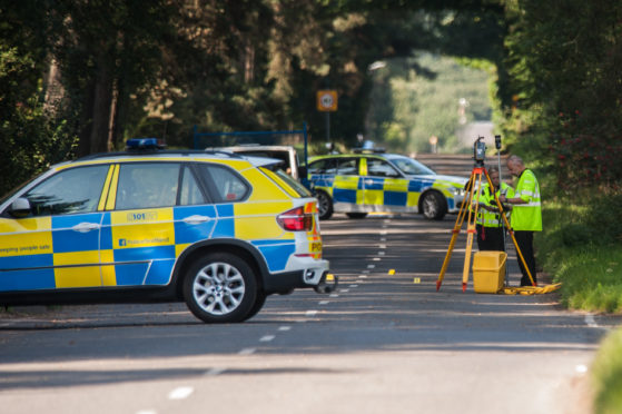 Investigators at the scene of a fatal crash on the B937 near Giffordtown in Fife.