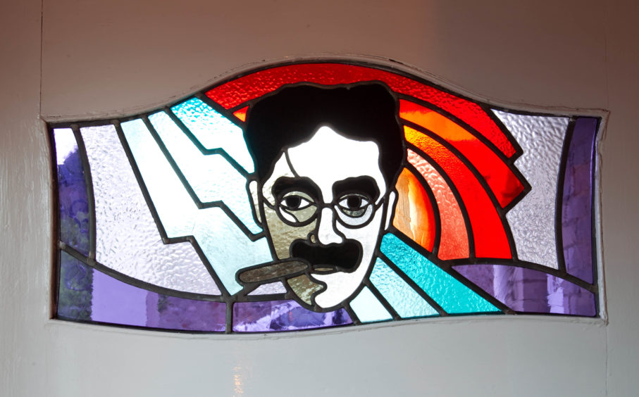 A Groucho's stainglass window in the Brodie household.